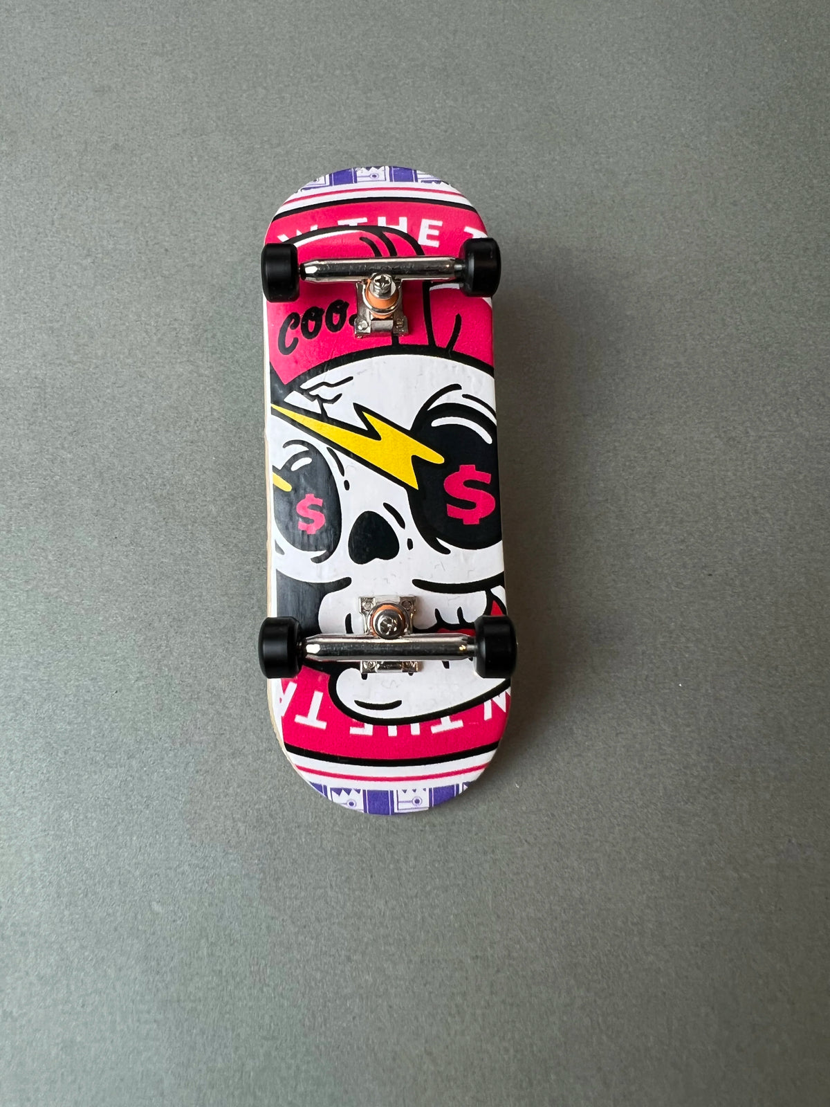 34 mm Death Gold Pro fingerboard with a gold skull graphic